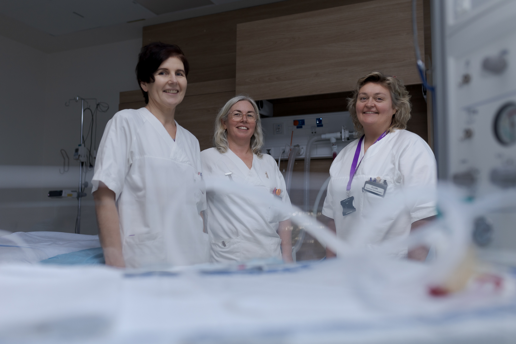 En gruppe mennesker i hvite laboratoriefrakker