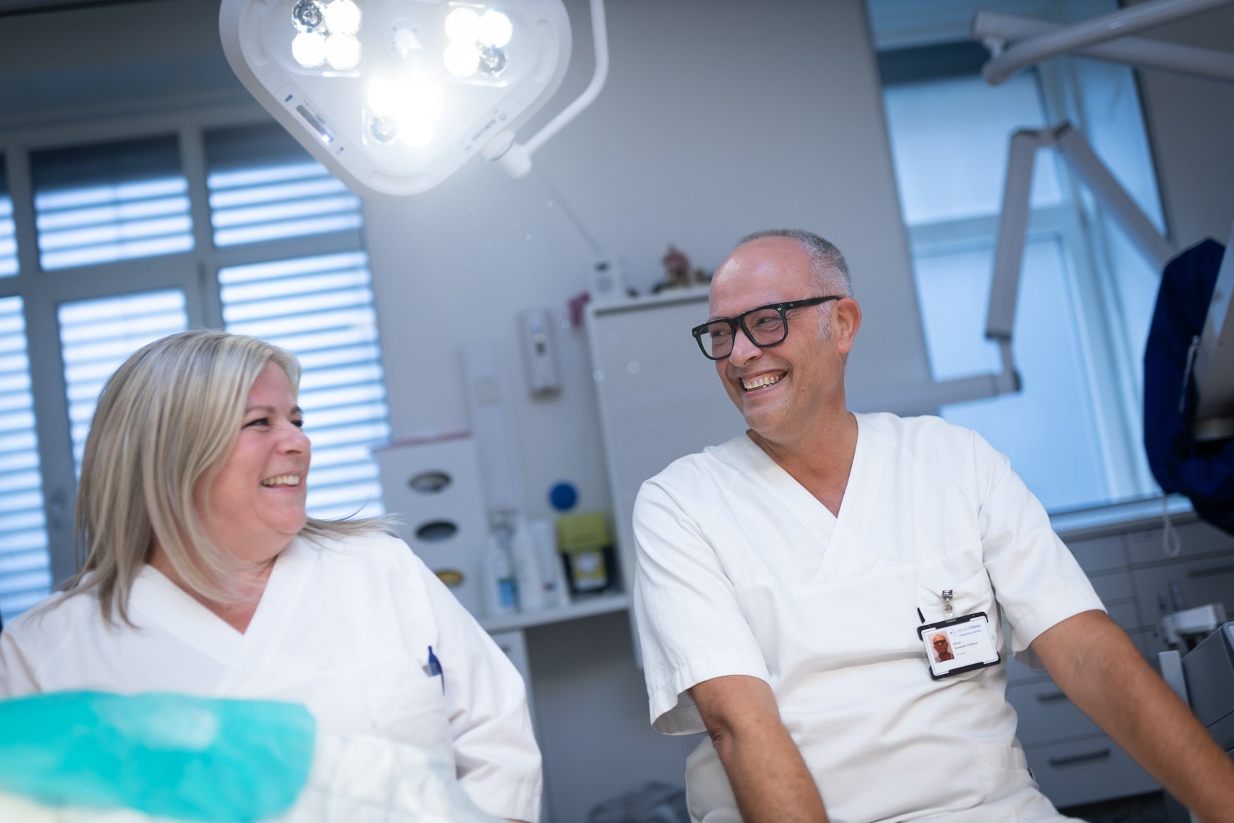 A man and a woman in a room with medical equipment