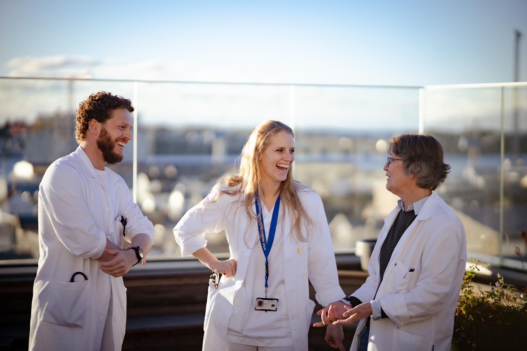 A few people in white coats