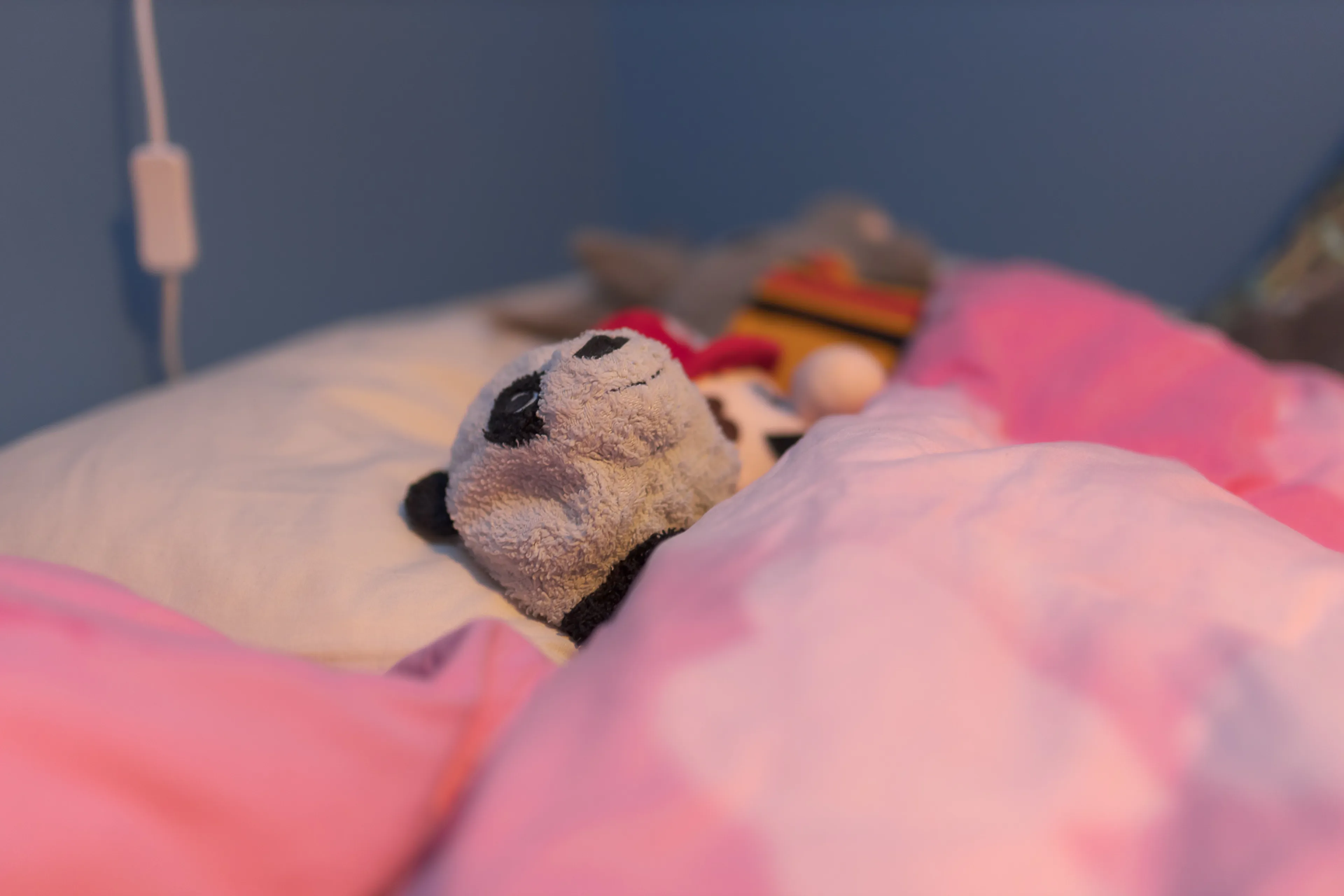 A stuffed animal on a bed