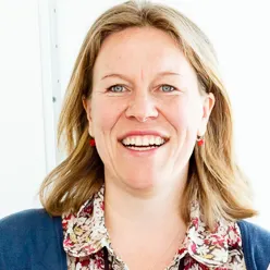 A woman smiling for the camera