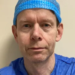 A man wearing a blue hat