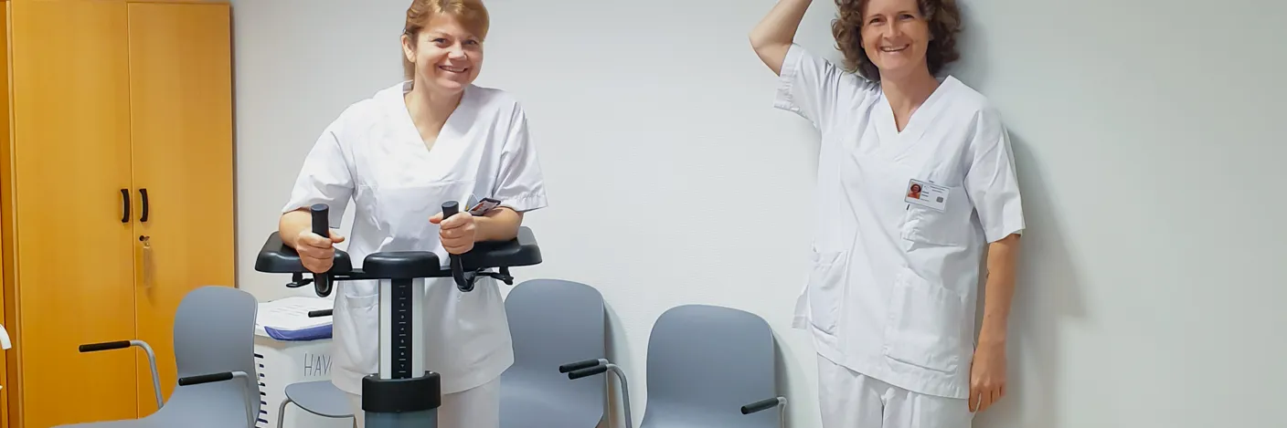A couple of nurses in white uniform