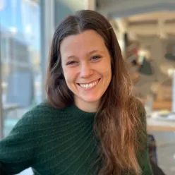 A woman smiling at the camera